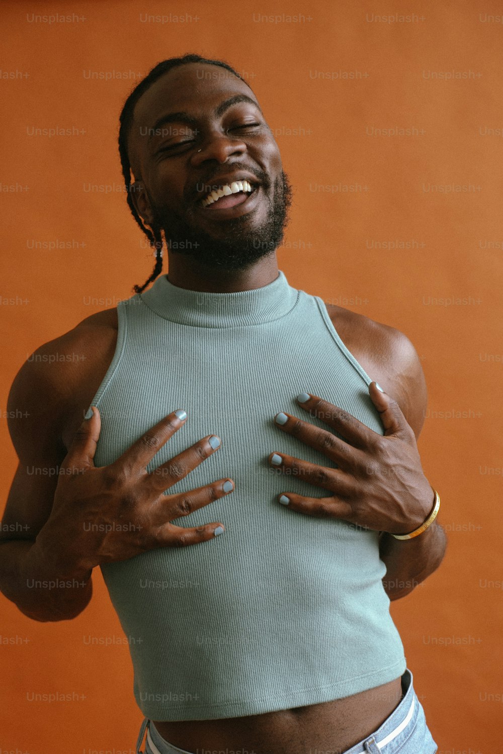 a man with his hands on his chest