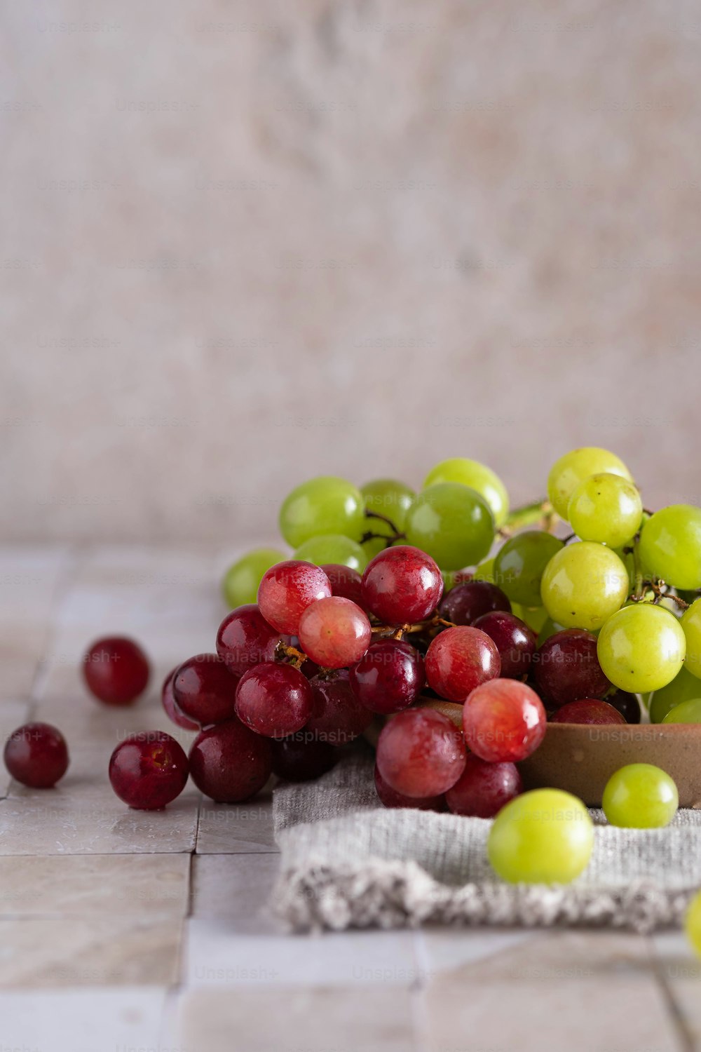 a bunch of grapes sitting on top of a table