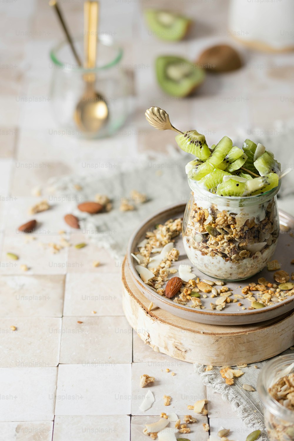 a jar filled with granola and nuts on top of a table