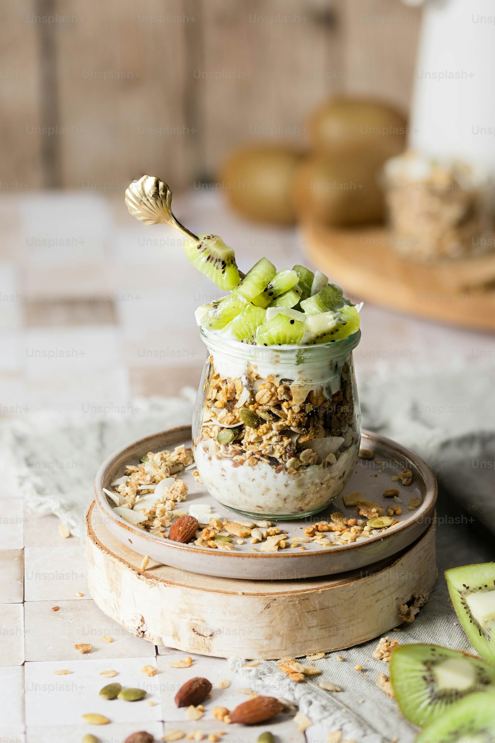 a glass jar filled with granola and nuts