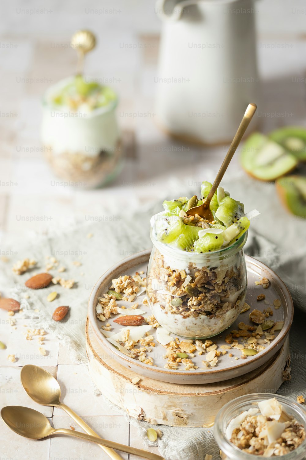 a jar of yogurt with granola and nuts