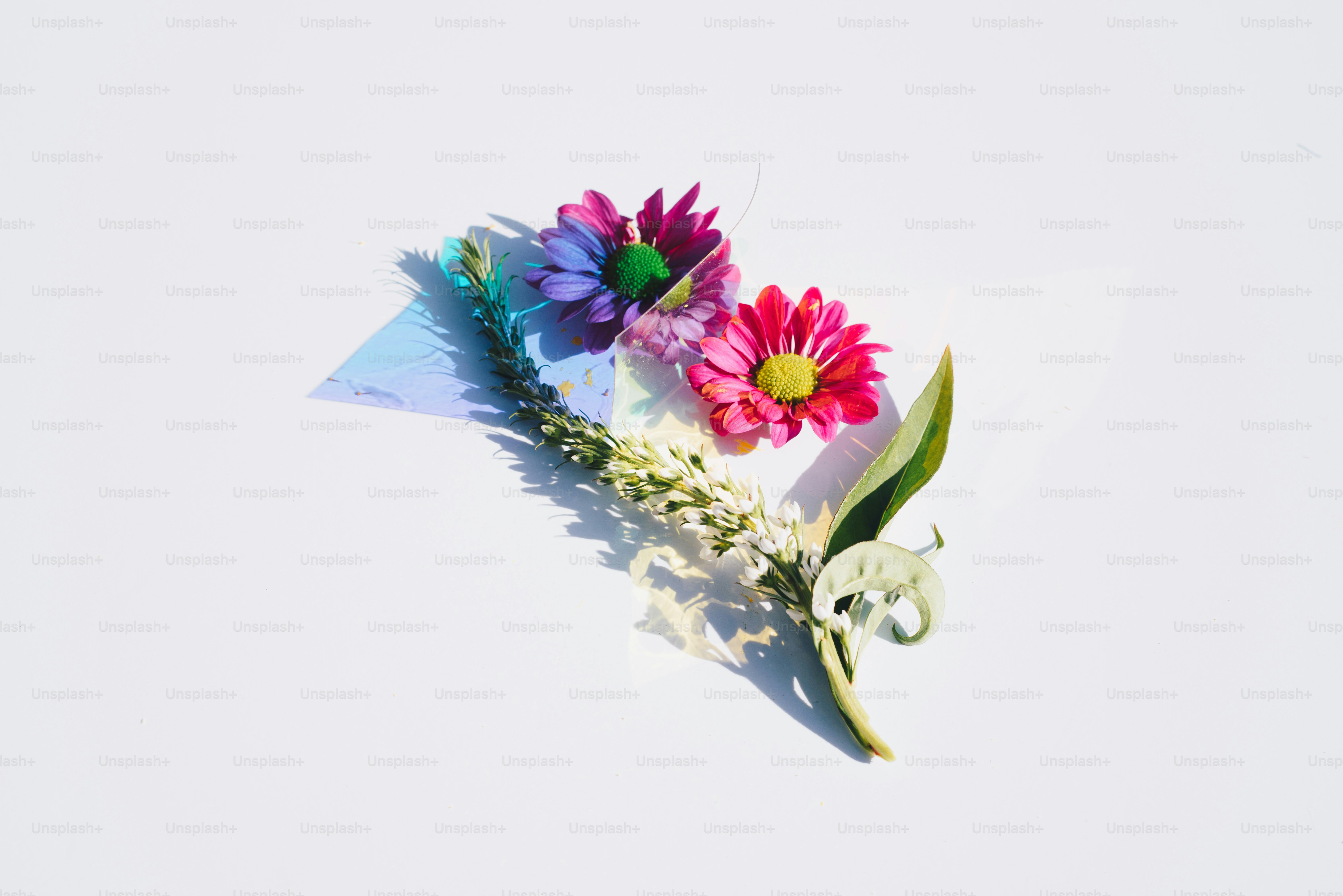 a bouquet of flowers sitting on top of a white table