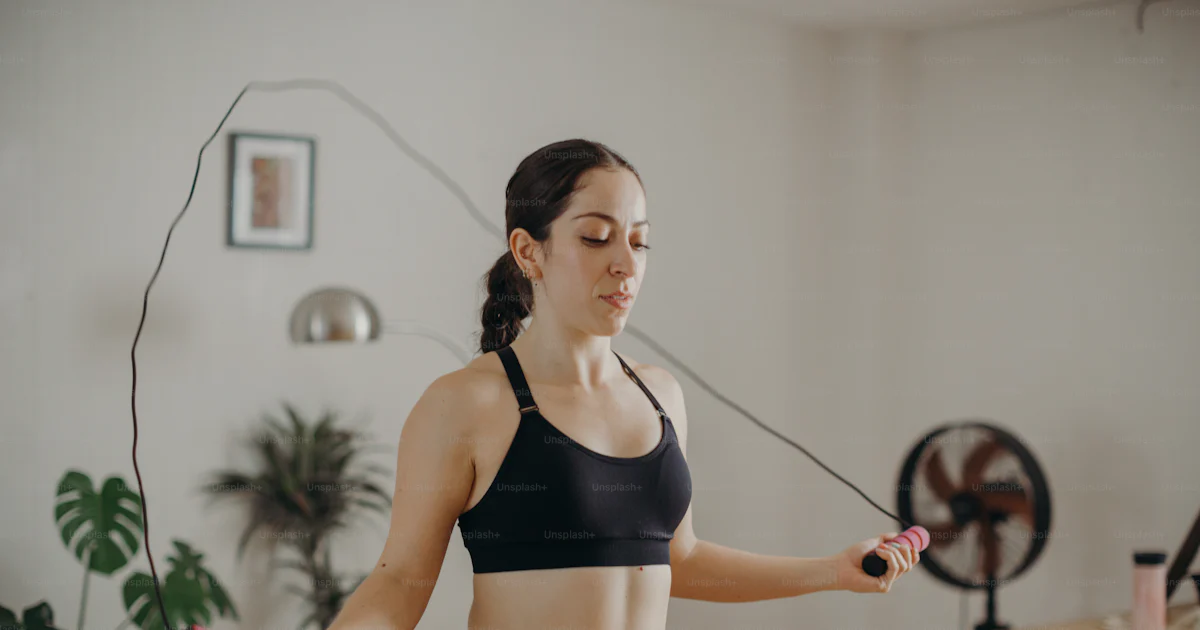 Sweatyatt Ropes A woman in a sports bra top holding a skipping rope photo – Sweaty ...