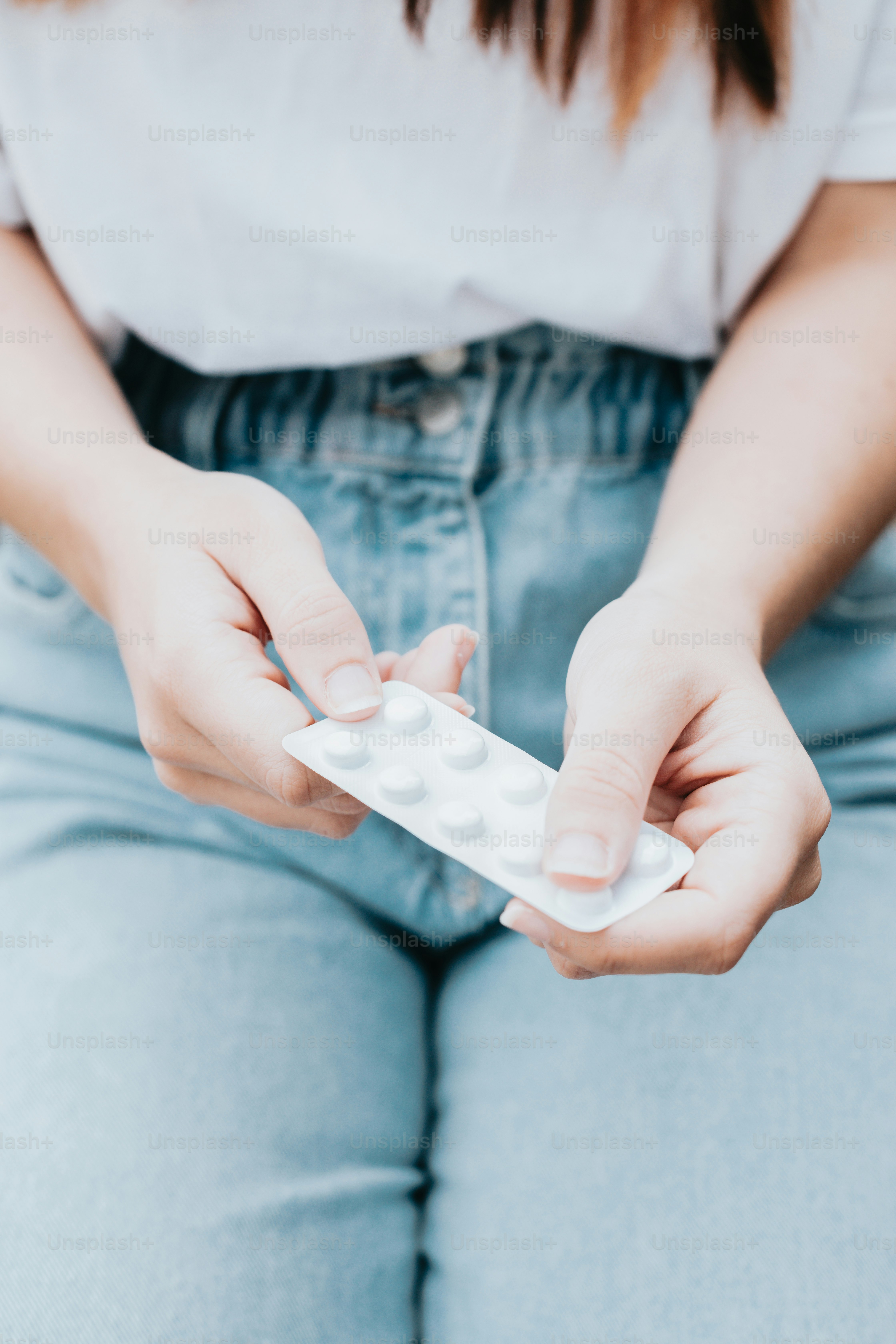 a woman holding a remote control in her hands