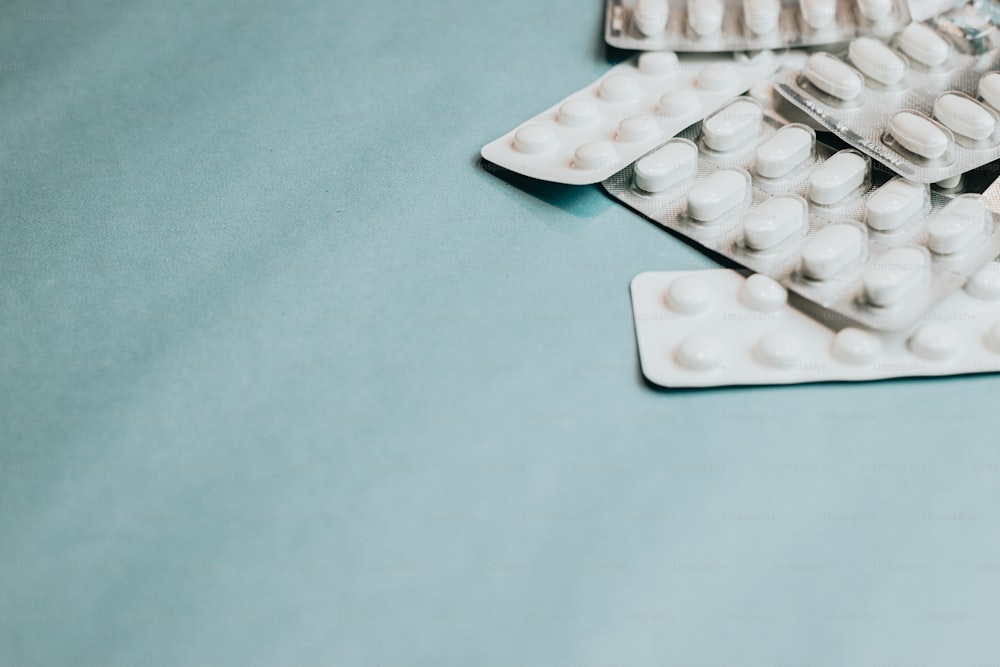 a close up of several pills on a table