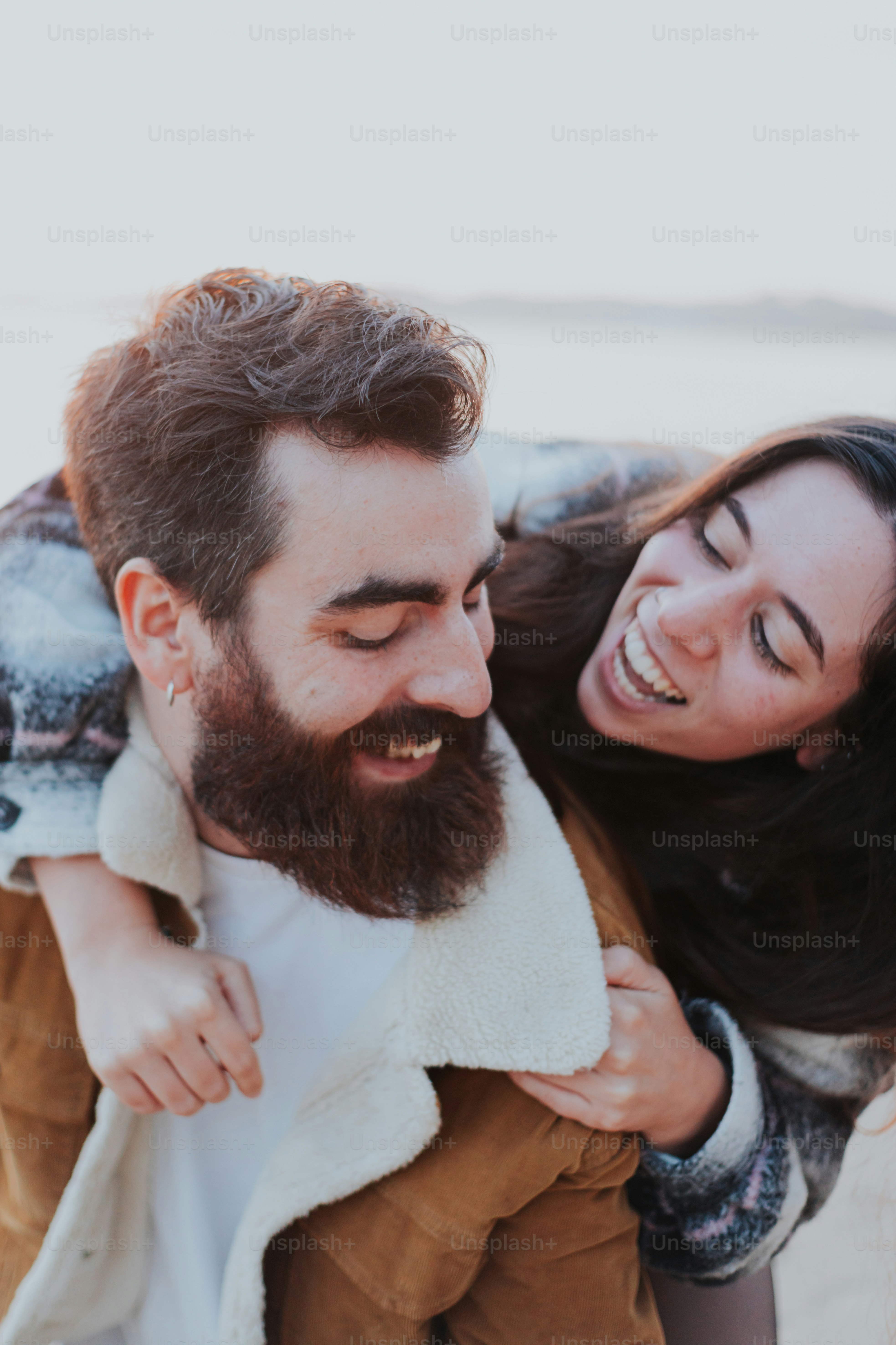 a man carrying a woman on his back