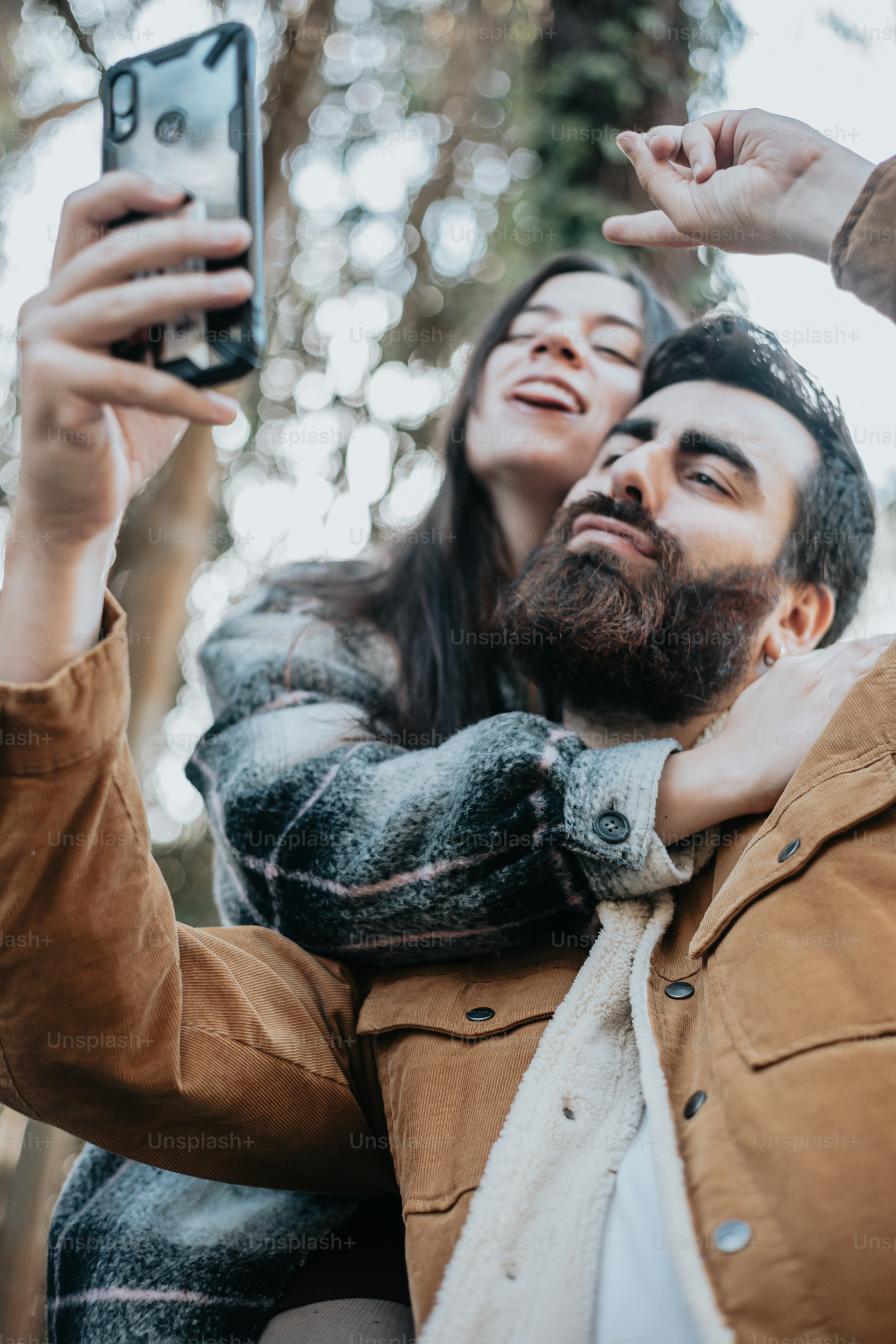A man and a woman standing in the woods photo – Woman Image on Unsplash