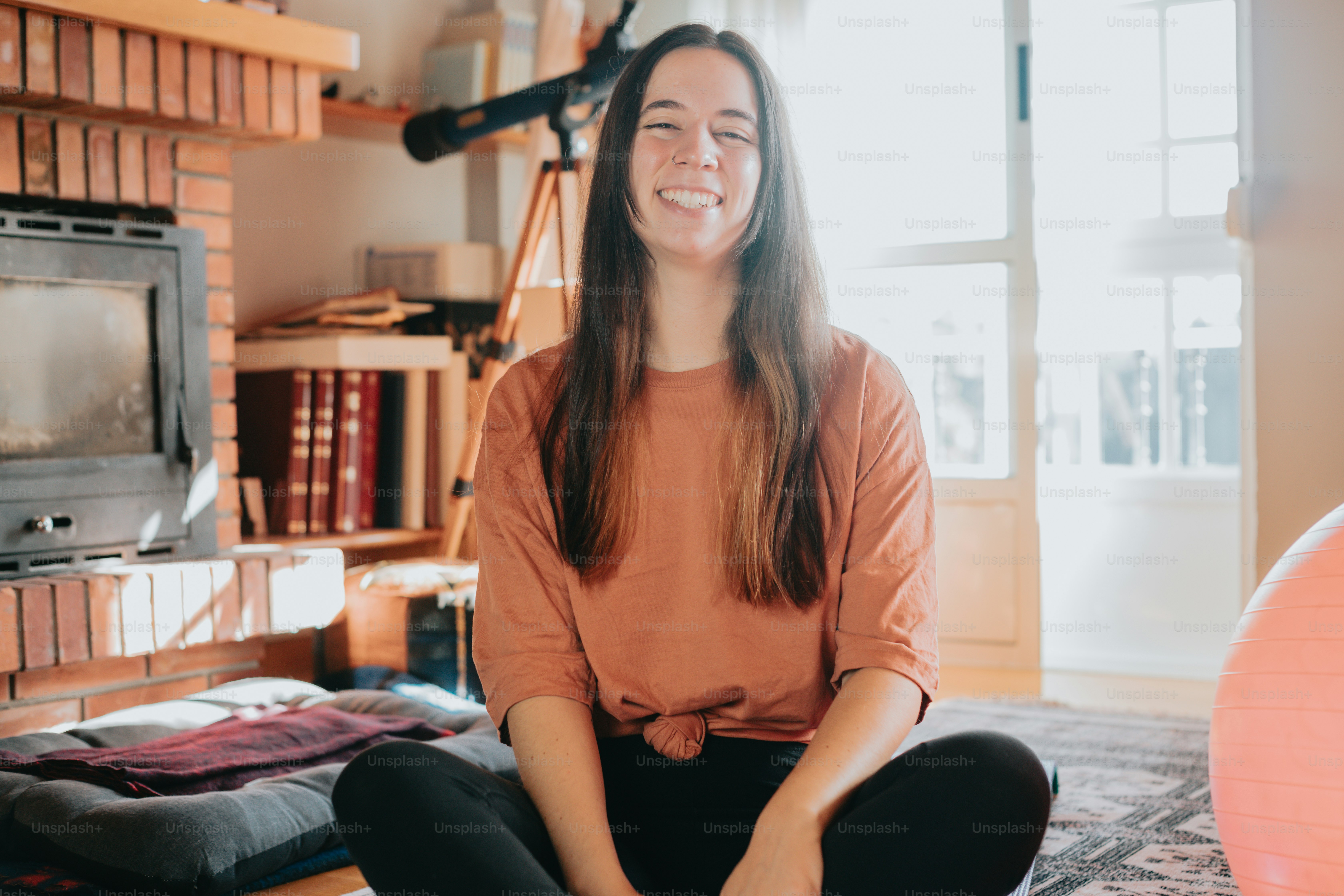 A woman sitting on the floor in front of a tv photo – Gym Image on Unsplash