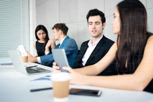 Business People discussing for new projects with Laptop and digital tablets computer in Modern Meeting Room.