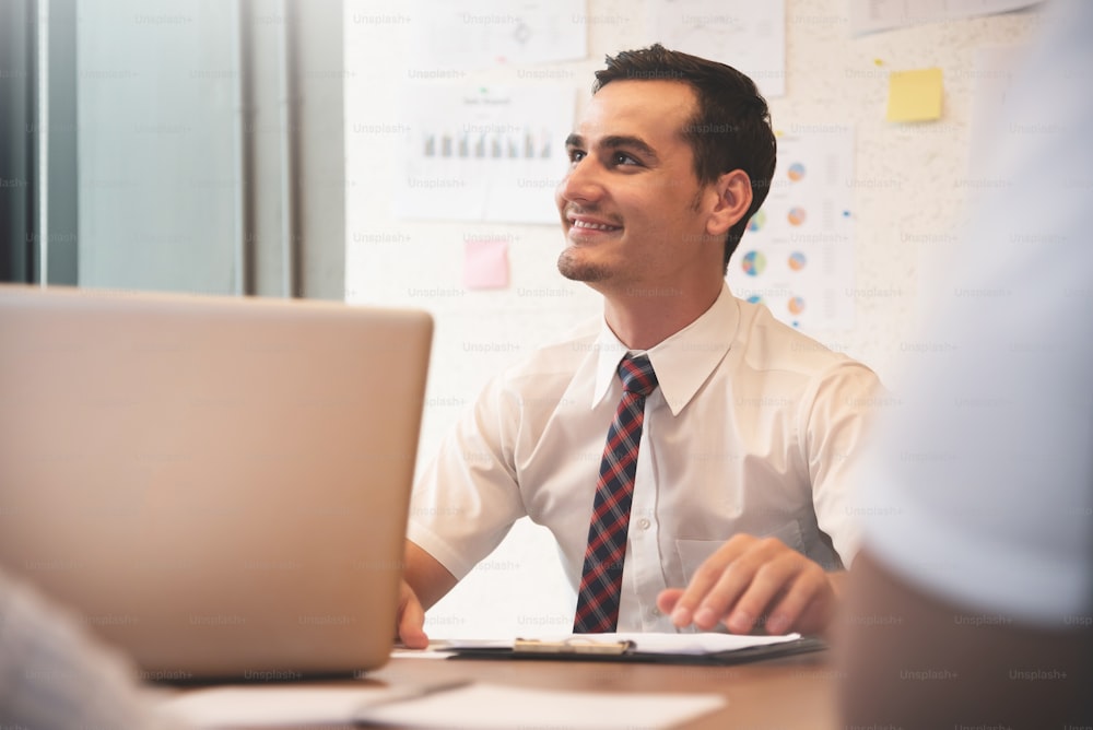 Confident Businessman smiling with working at the office.