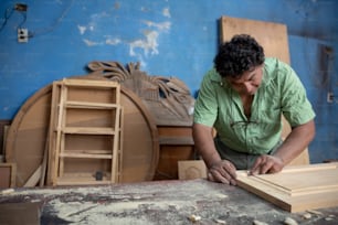 Mexican woodworker, carpenter working in his workshop
