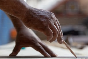 close-up carpenter hands measuring