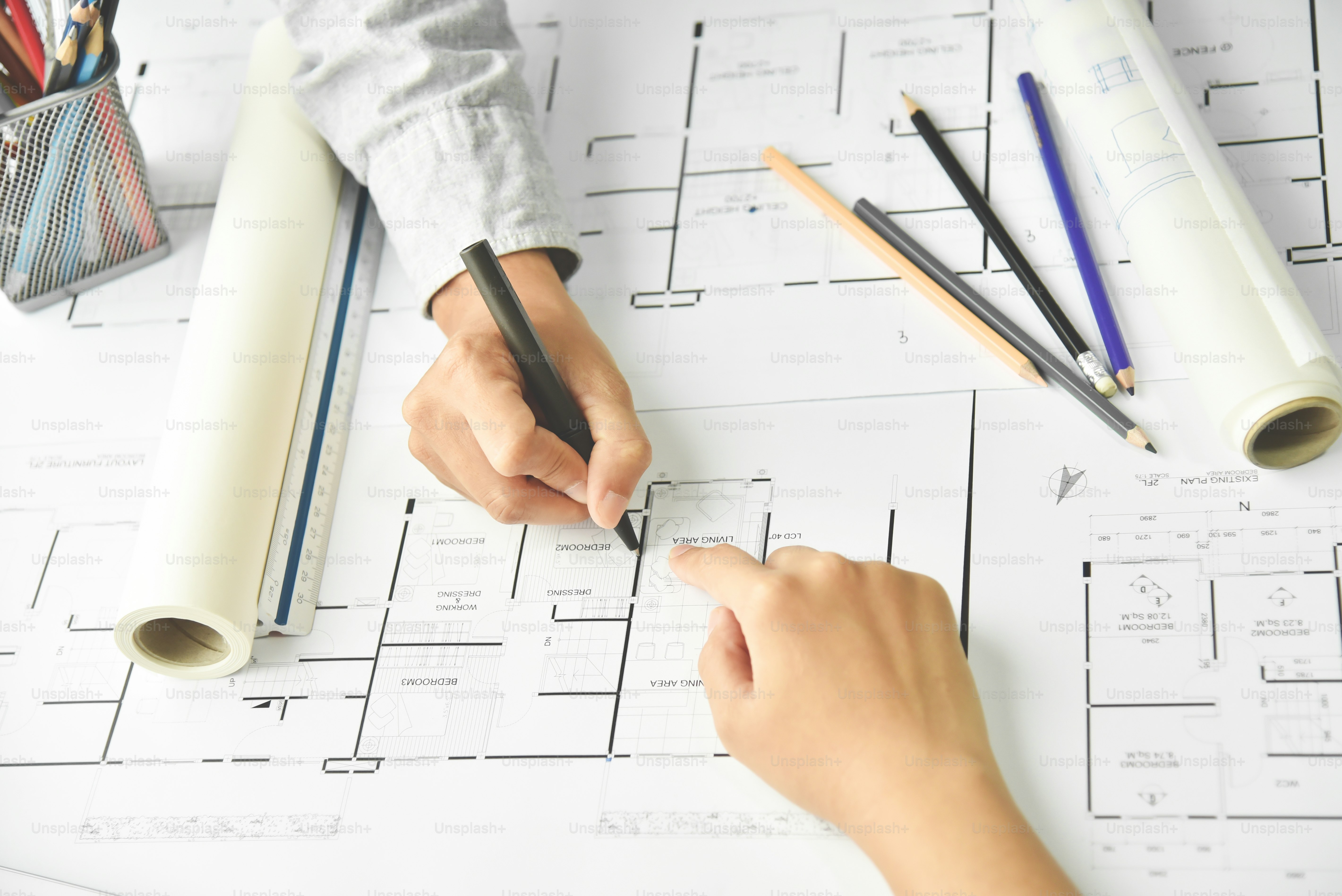 Top view. Creative Designers brainstorming with Interior, Architecture blueprint. Office supplies equipment.