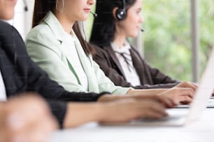 Asian women working in call center. customer service with headset.