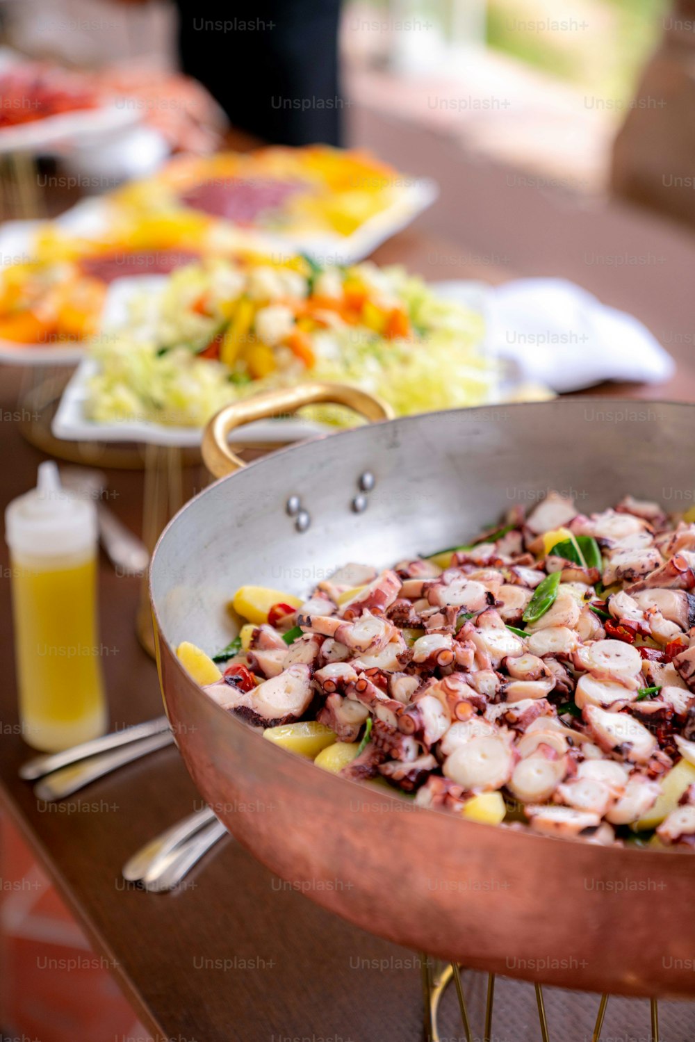 a large metal pan filled with food on top of a table