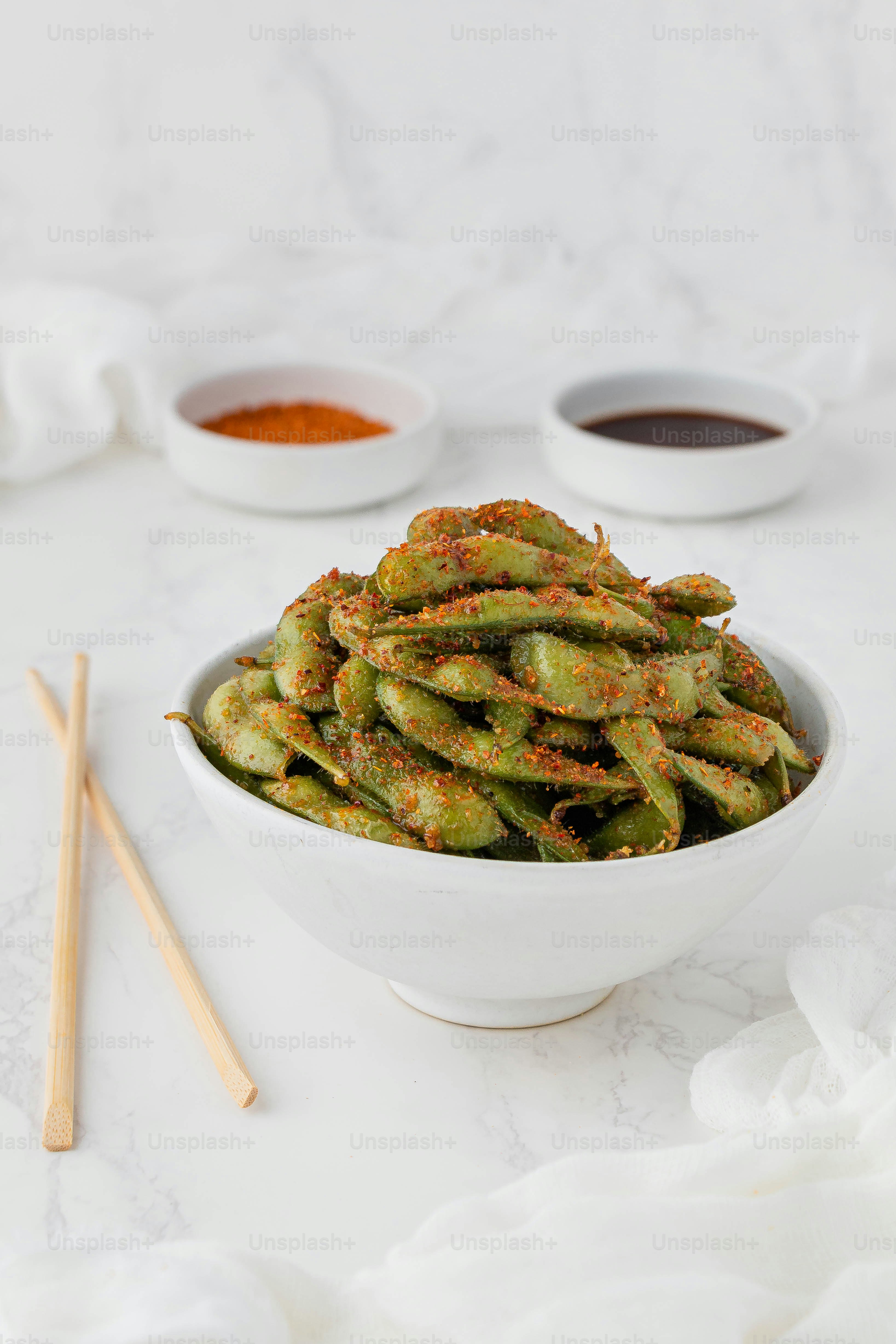 a white bowl filled with fried green beans