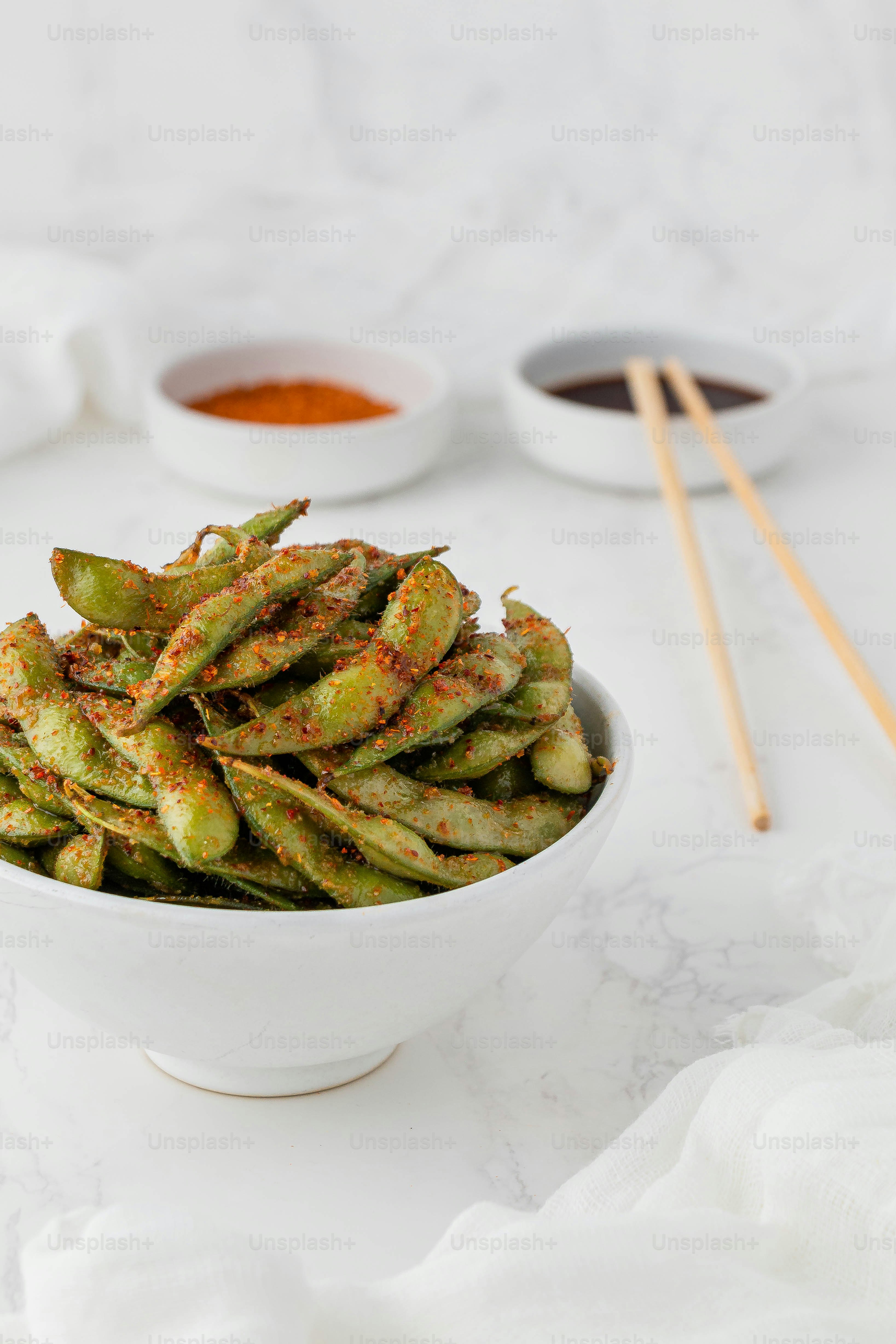 a white bowl filled with fried green beans