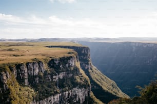 a view of a mountain with a valley in the background