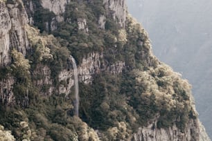 a mountain with a waterfall in the middle of it