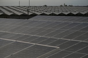 a row of rows of solar panels on a roof