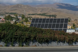 a large solar panel on the side of a road