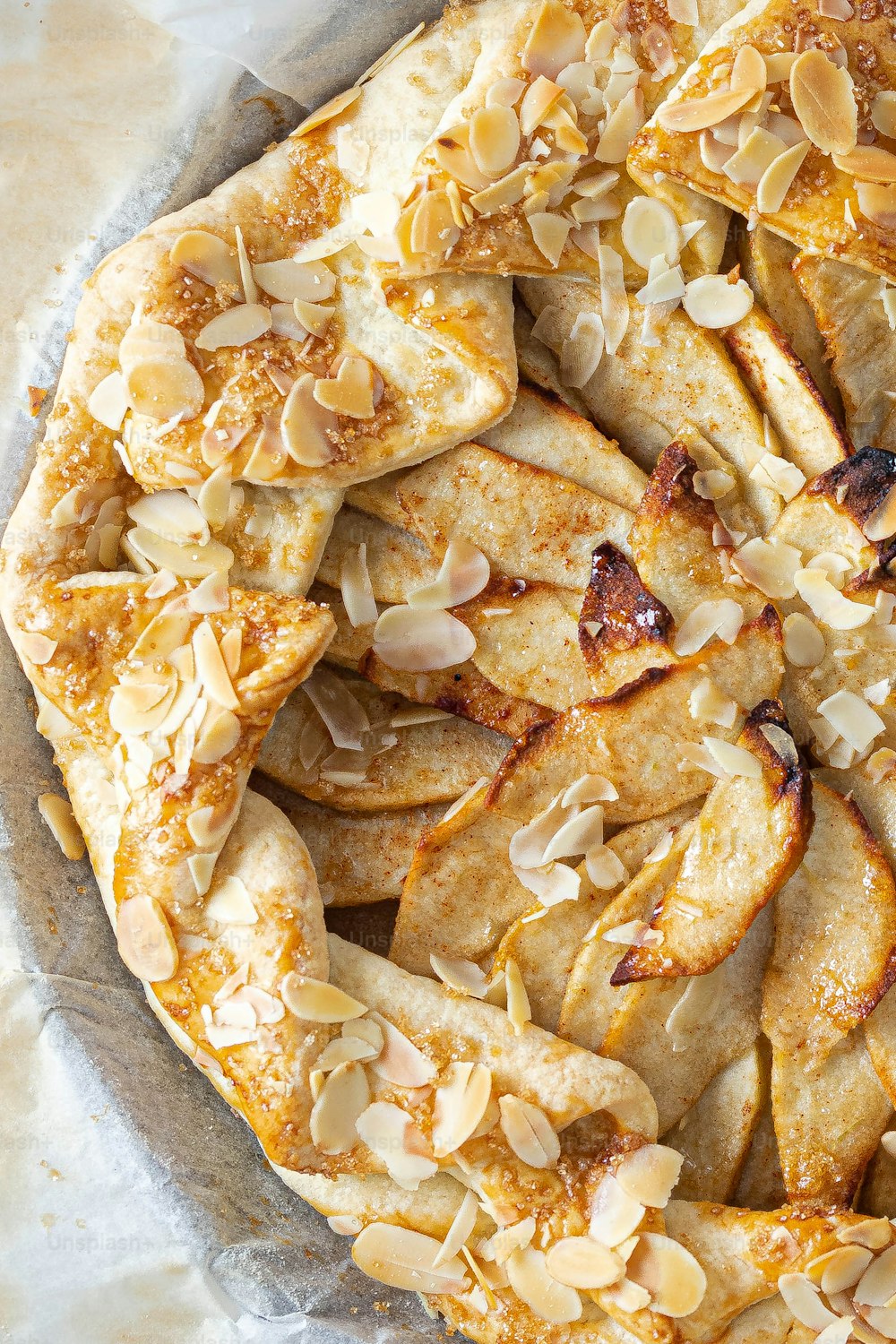 a pie with almonds on top of it