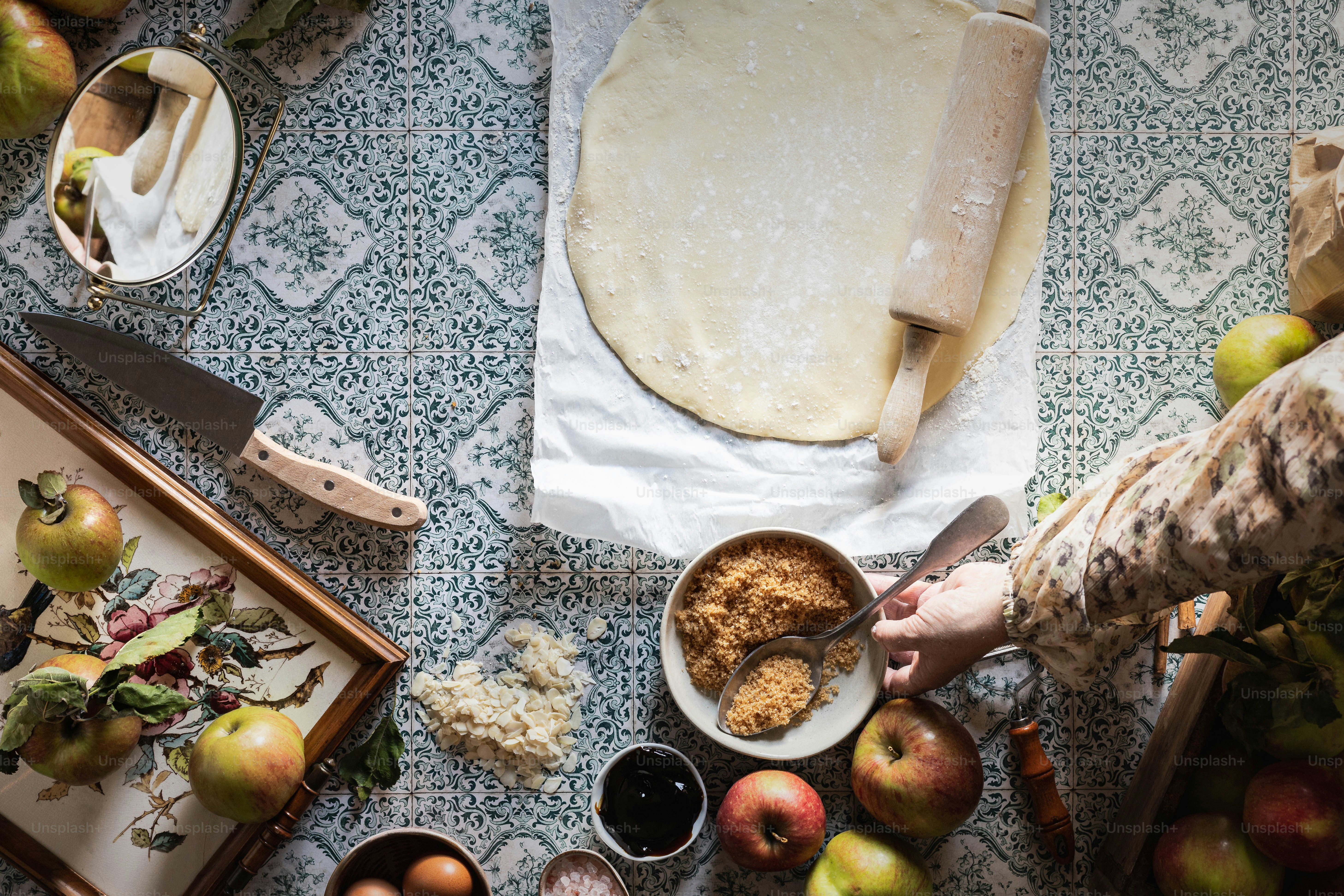 a table topped with bowls of food and a knife