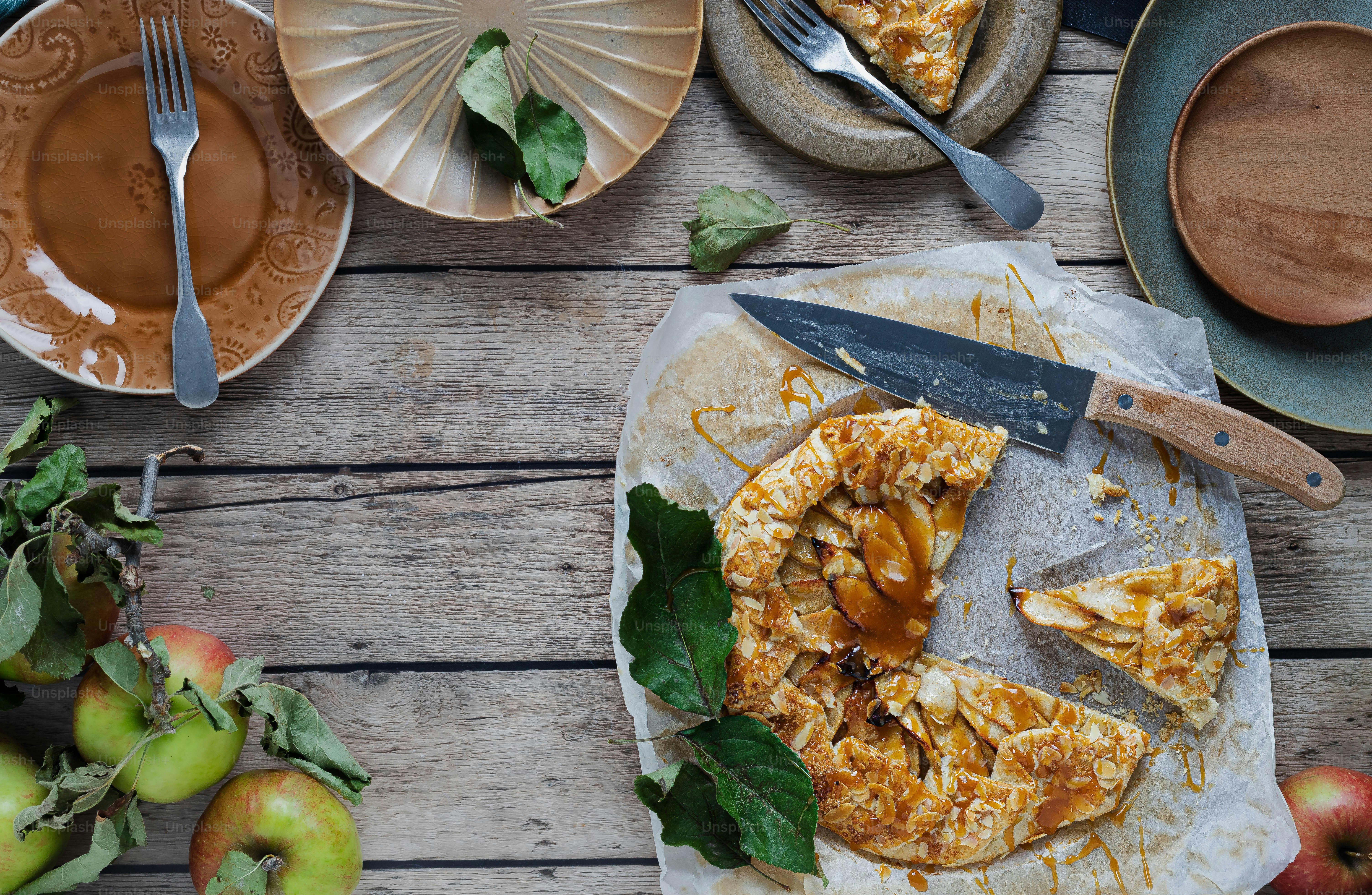 a table topped with plates of food and a knife