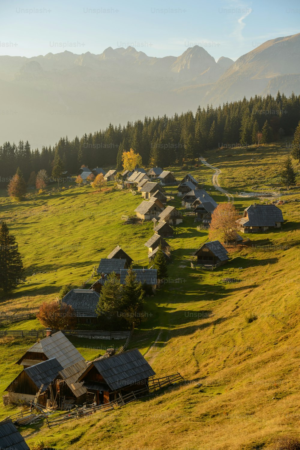 a small village in the middle of a grassy field