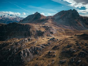an aerial view of a mountain range in the mountains