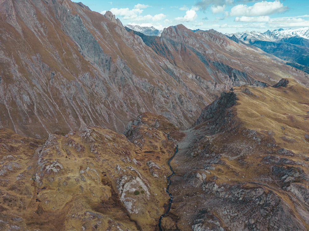 an aerial view of a mountain range with a river running through it