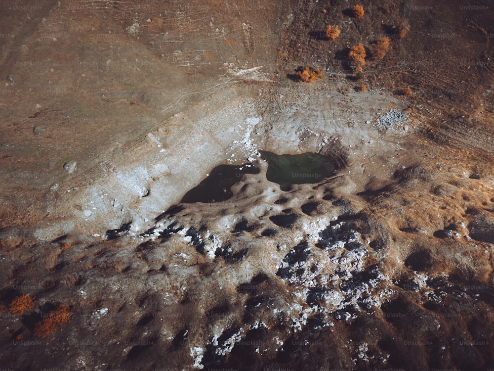 a hole in the ground with dirt on it