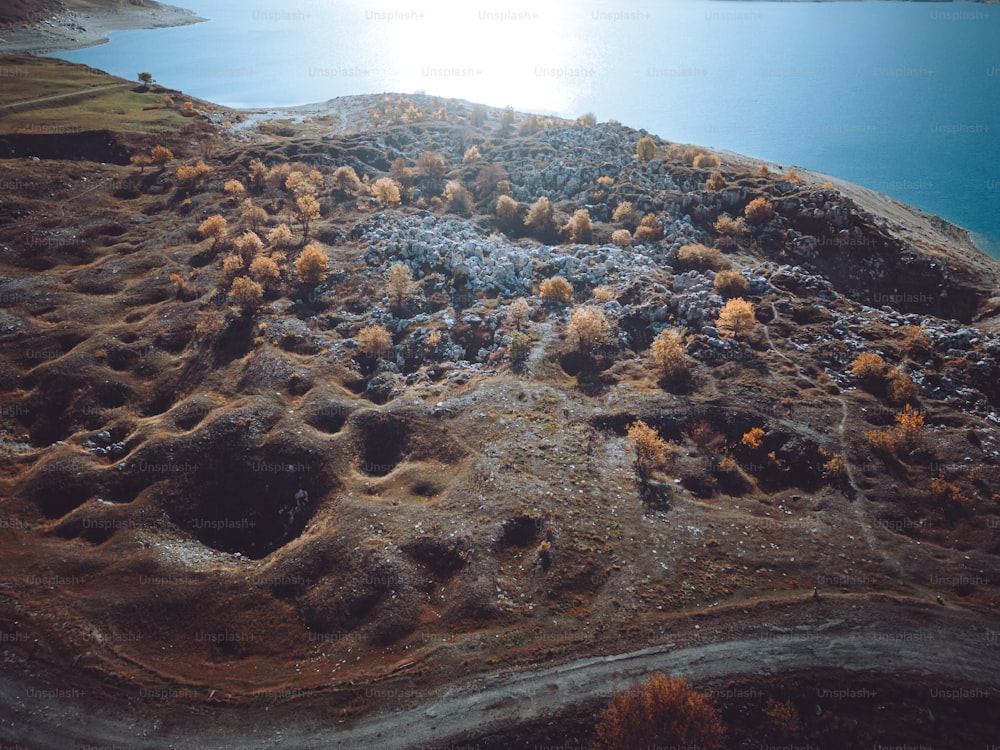 an aerial view of a lake surrounded by land