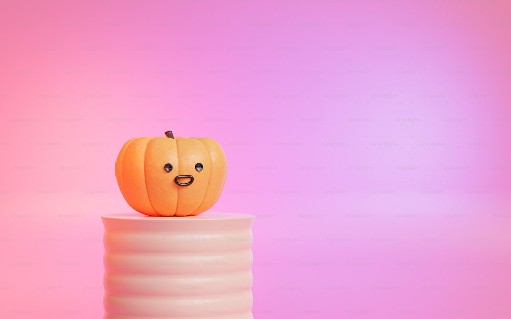 a small pumpkin sitting on top of a stack of white plastic