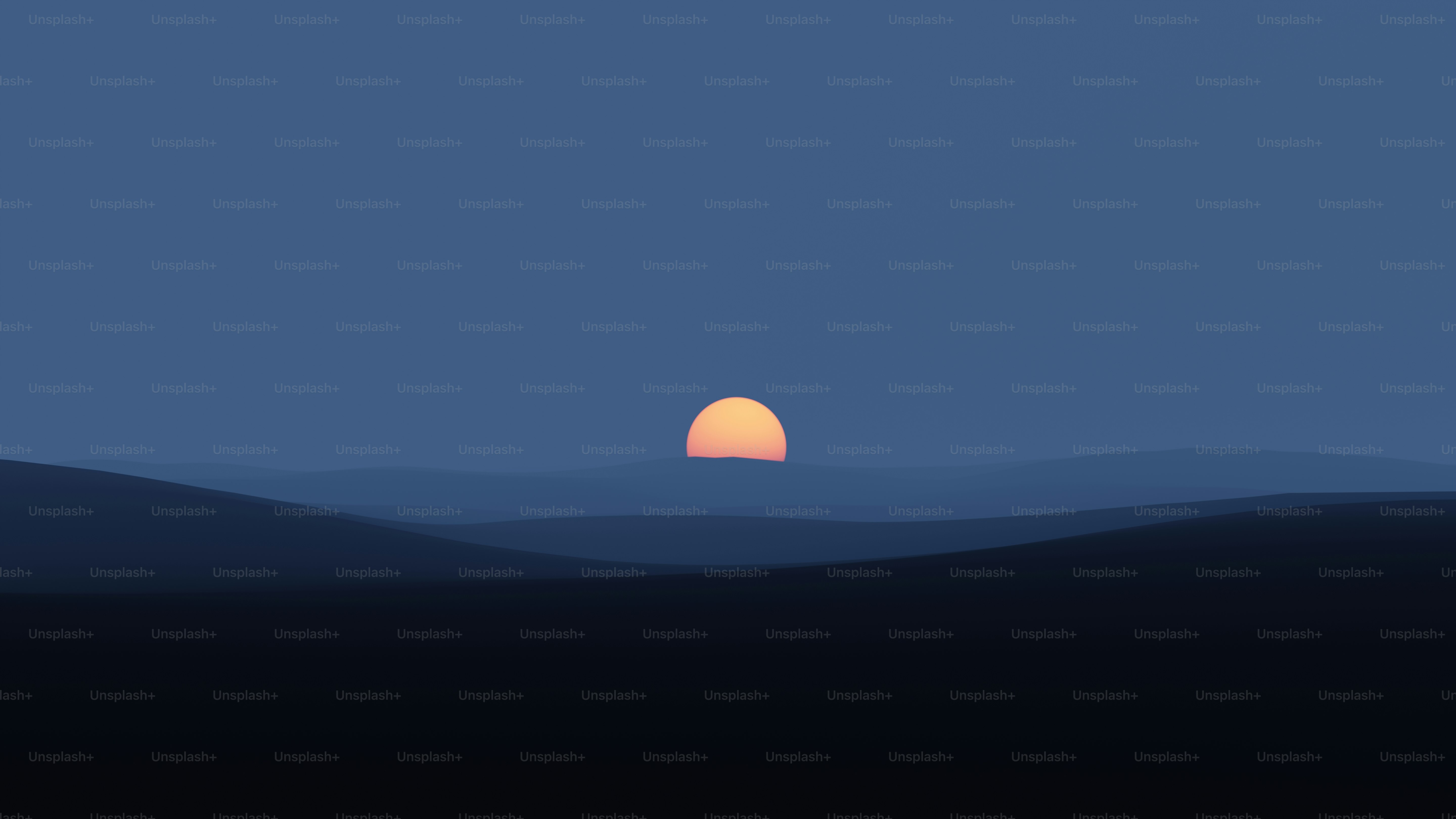 the sun is setting over a mountain range