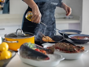 a person cooking food on a stove top