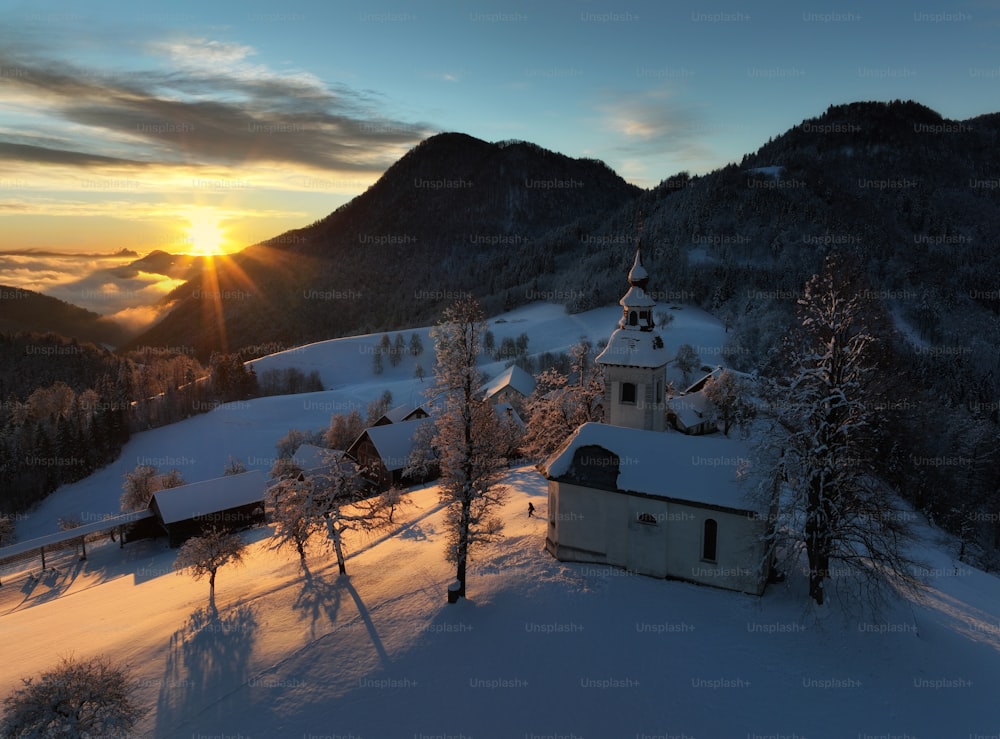 a church in the middle of a snowy landscape