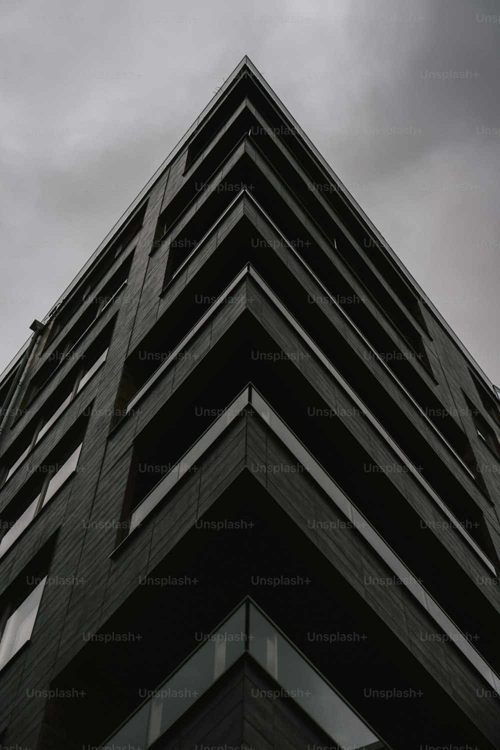 a tall building with a sky background