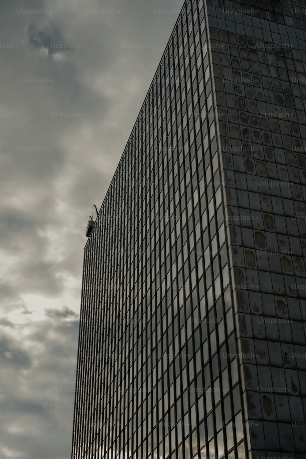 a very tall building with a sky background