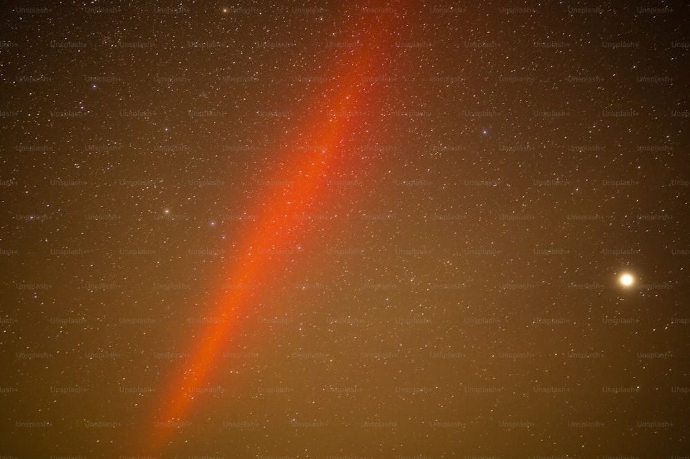 a bright orange streak in the night sky