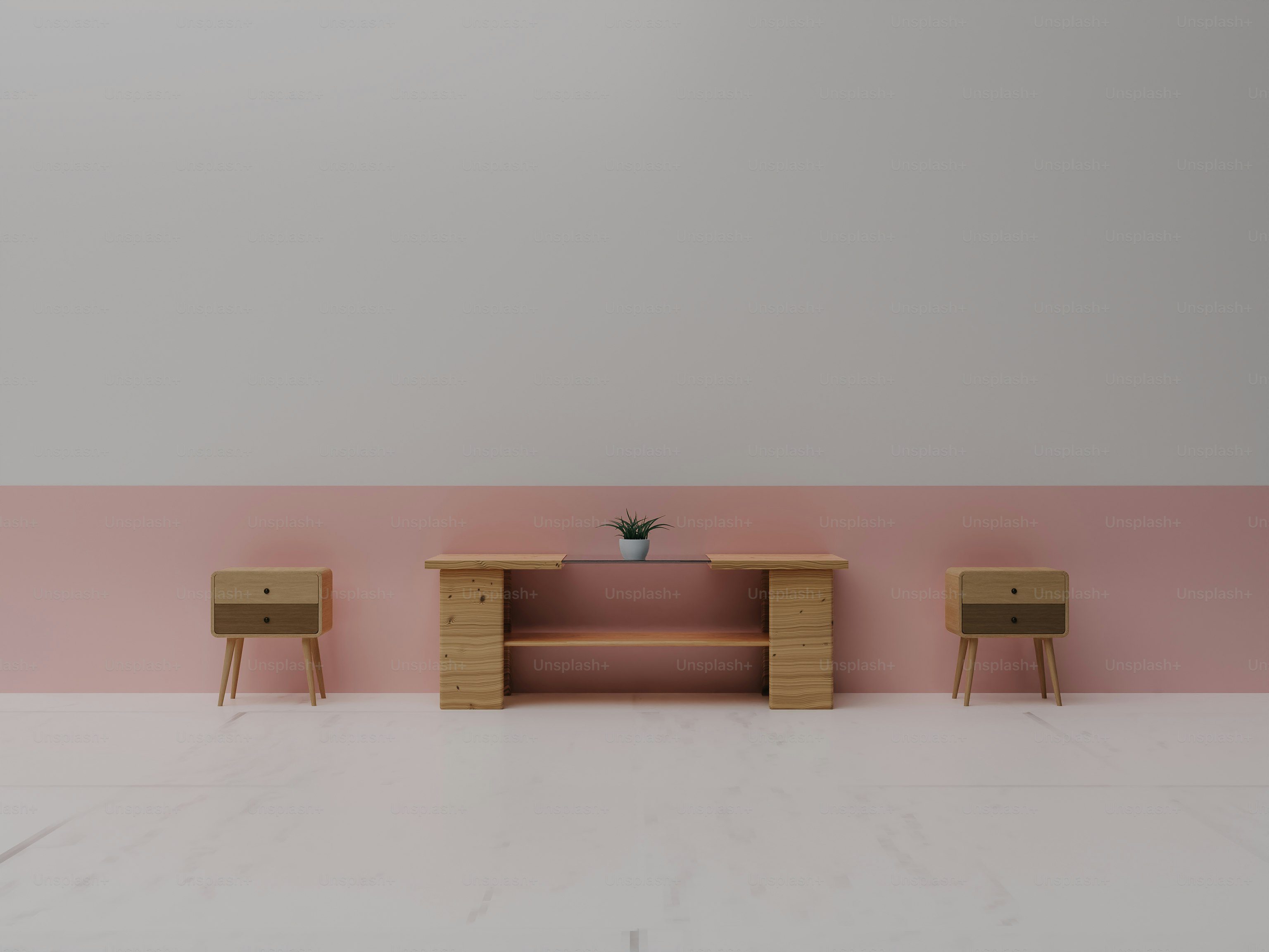 a pink and white room with two wooden tables