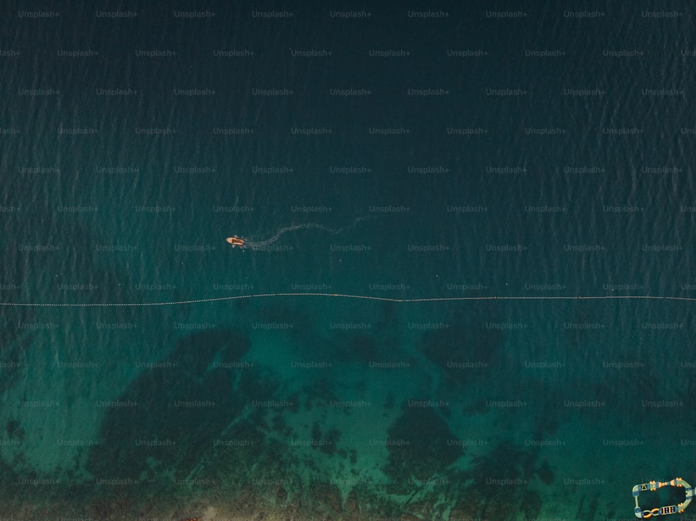 an aerial view of a boat in the water