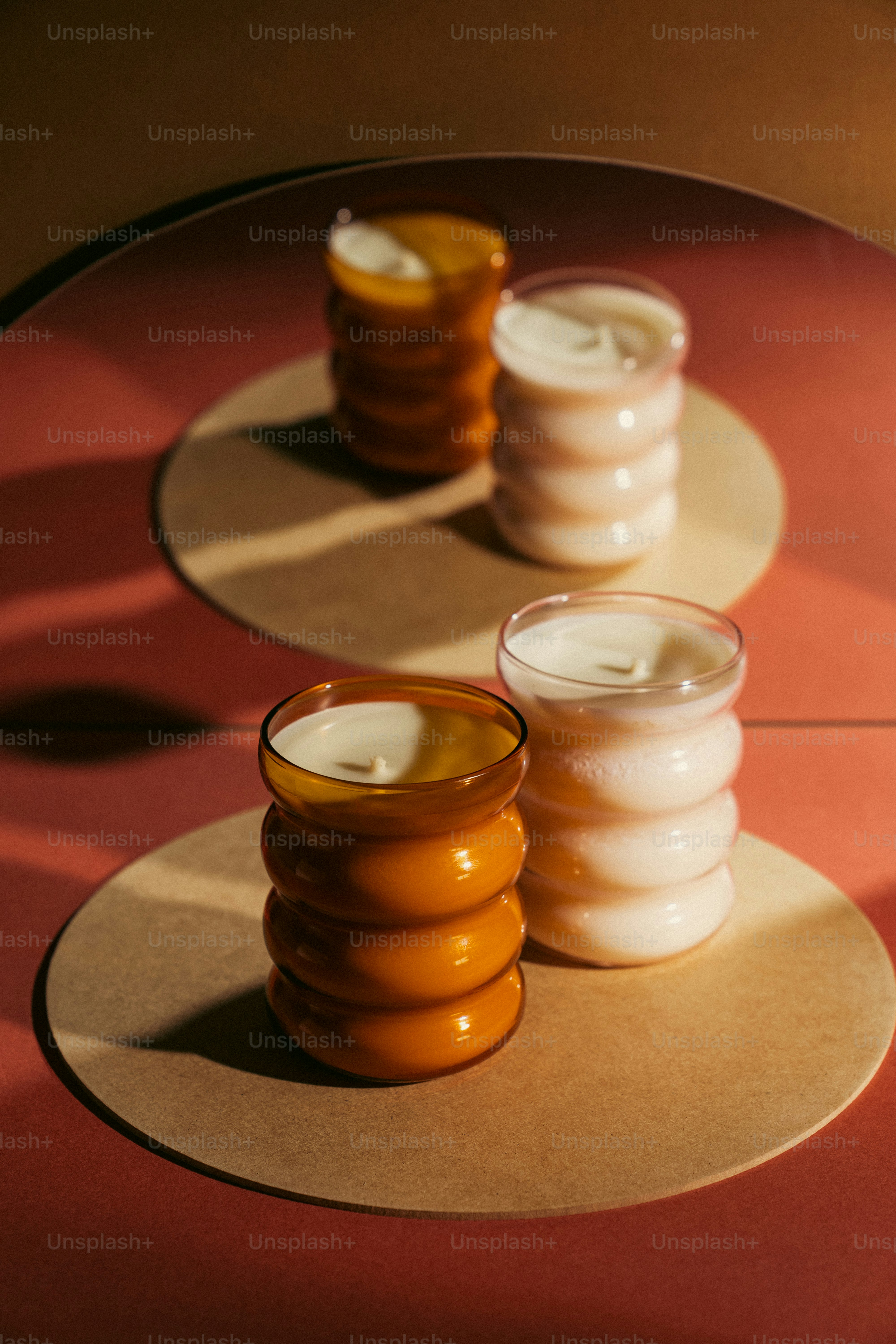a couple of candles sitting on top of a table
