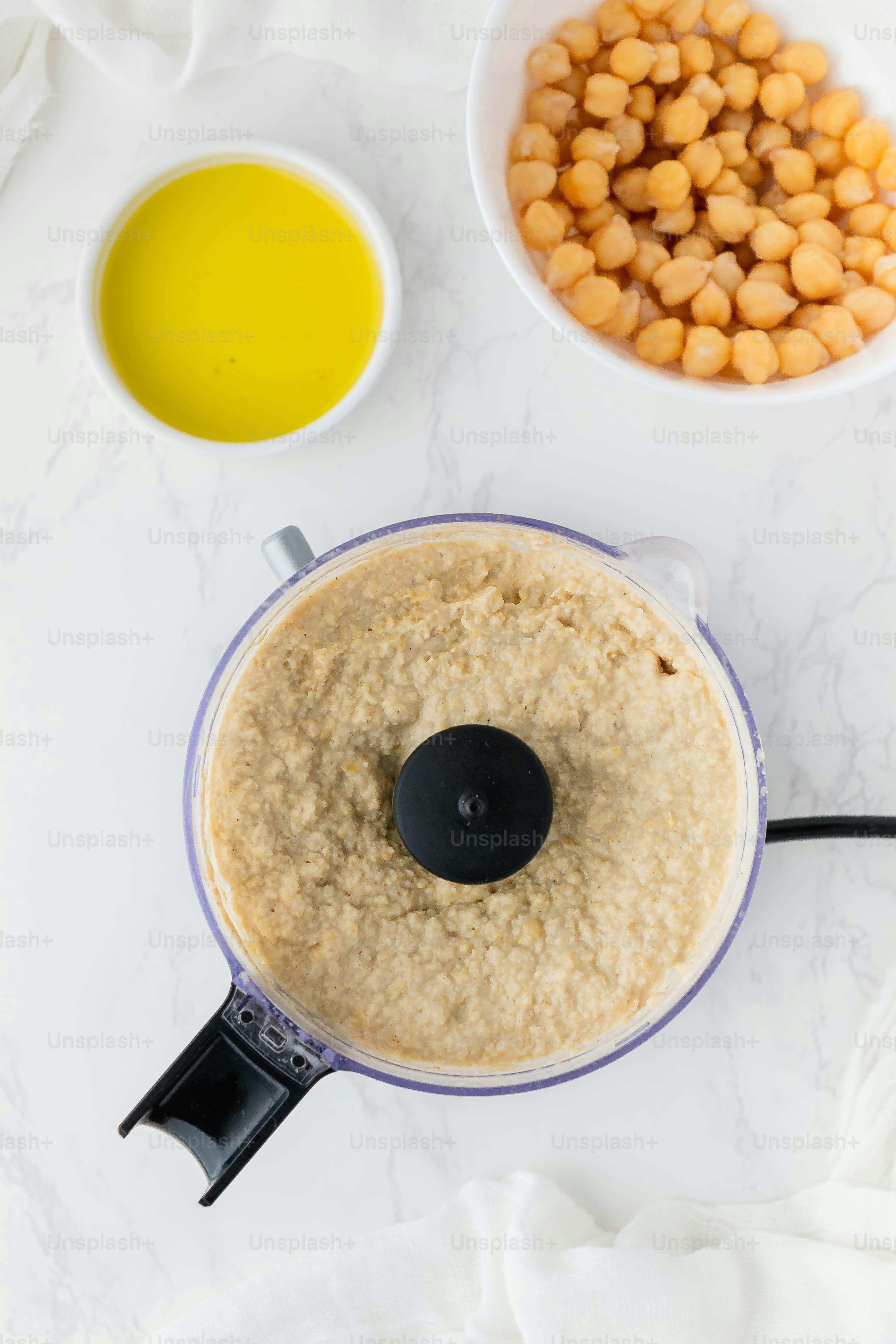 a food processor with a mixture of food in it