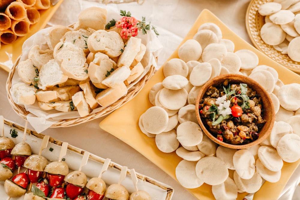 a table topped with plates and bowls of food