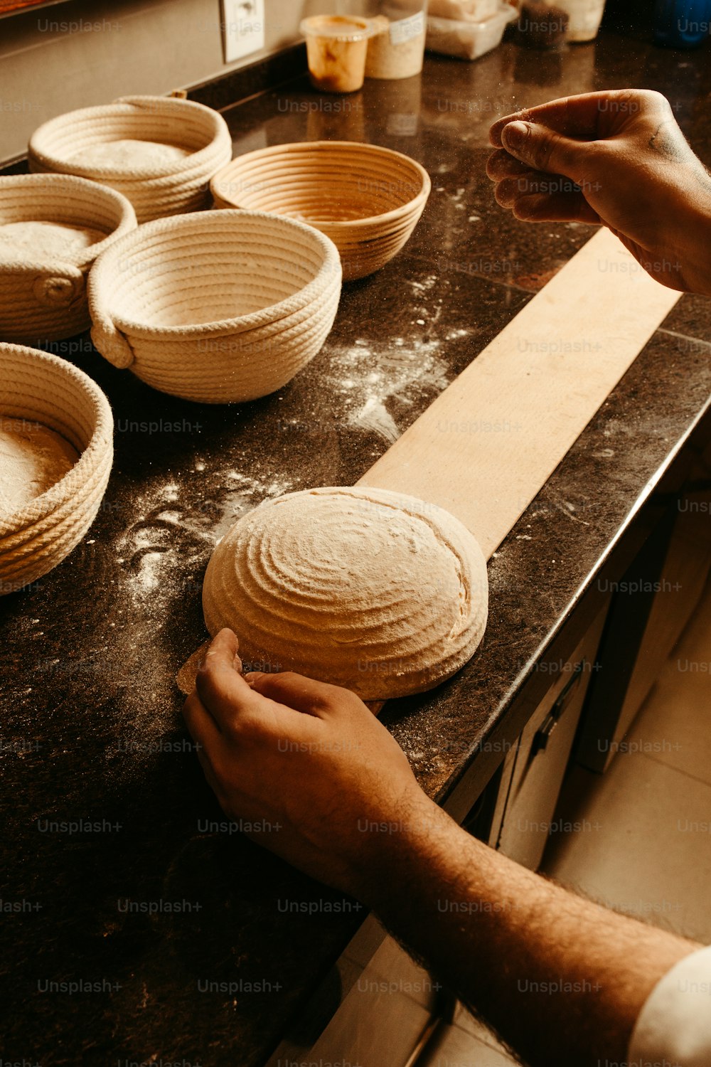 a person is making bread in a kitchen