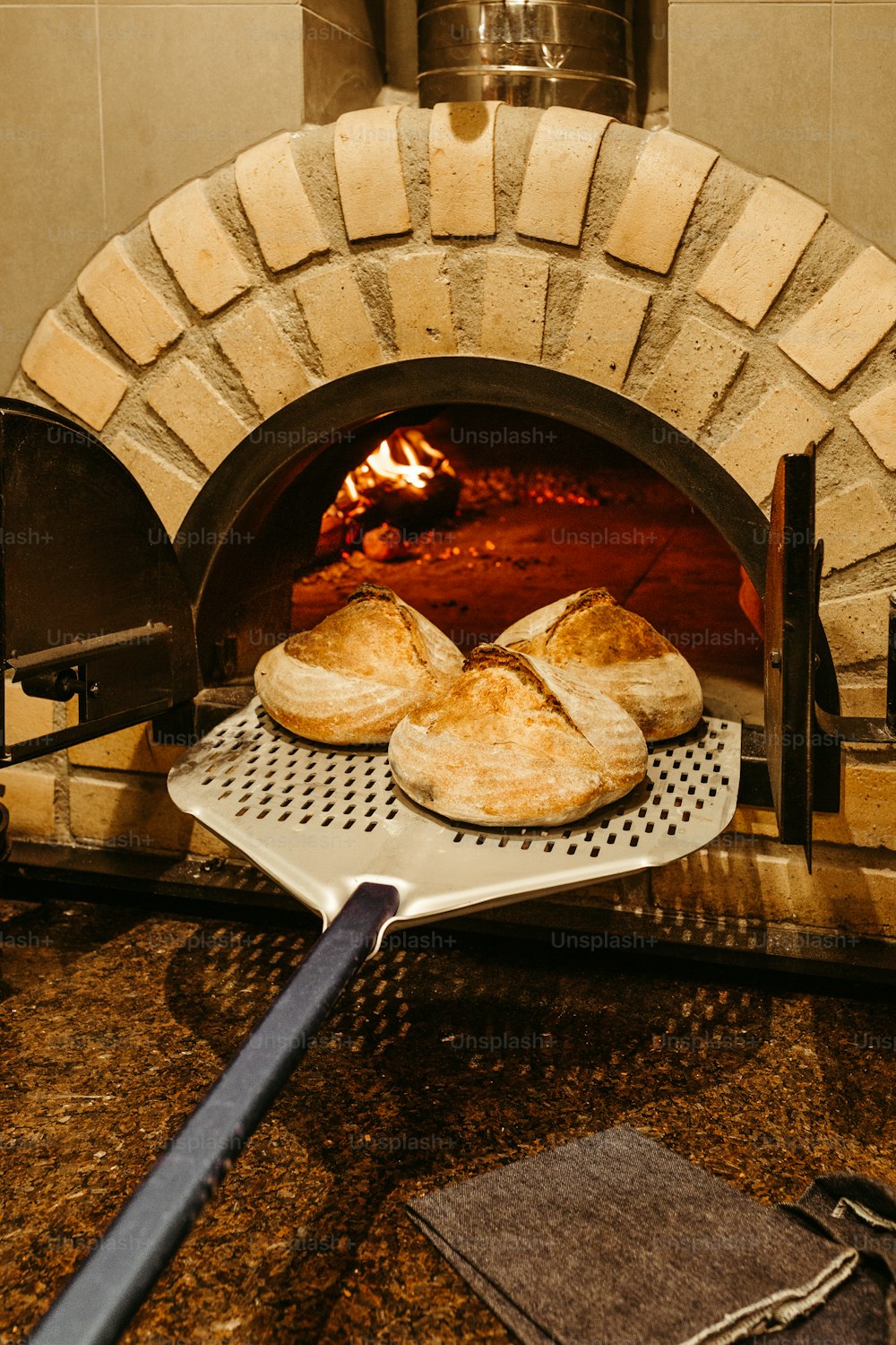 a pizza oven with some bread in it