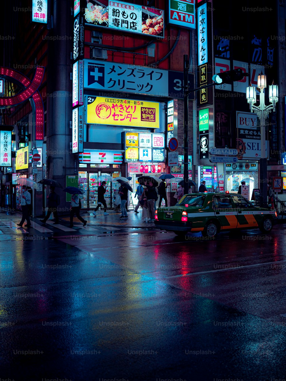 a busy city street at night with neon signs