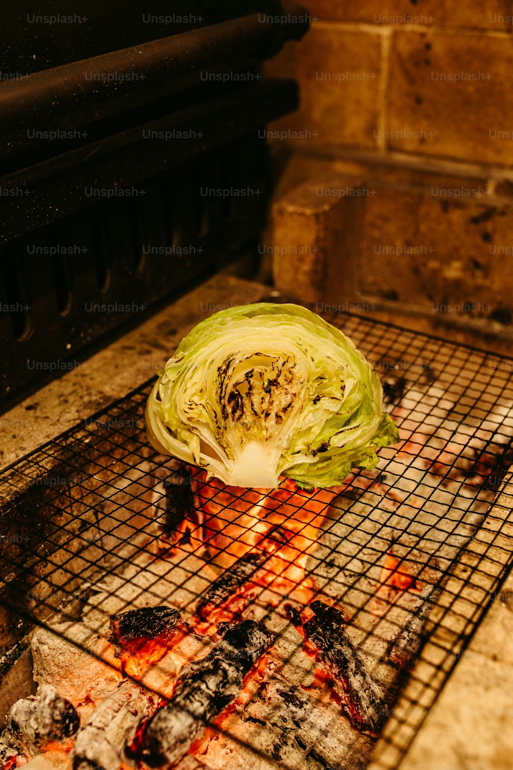 a grilled head of cabbage on a grill