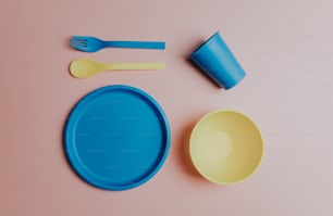 a blue and yellow plate and a yellow and blue cup